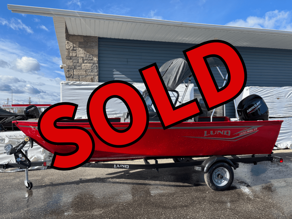 A red boat on a trailer with a large red SOLD text overlay.