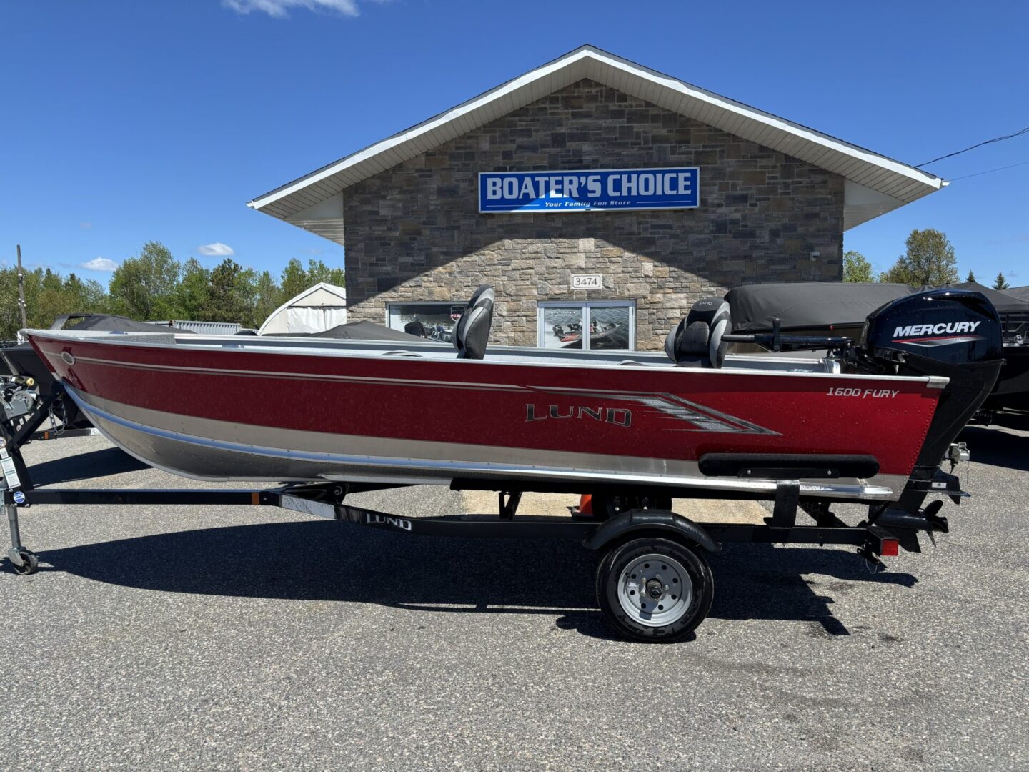 Full profile red Lund on trailer