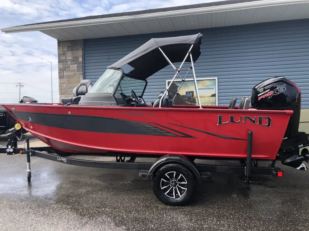 red and black Lund boat