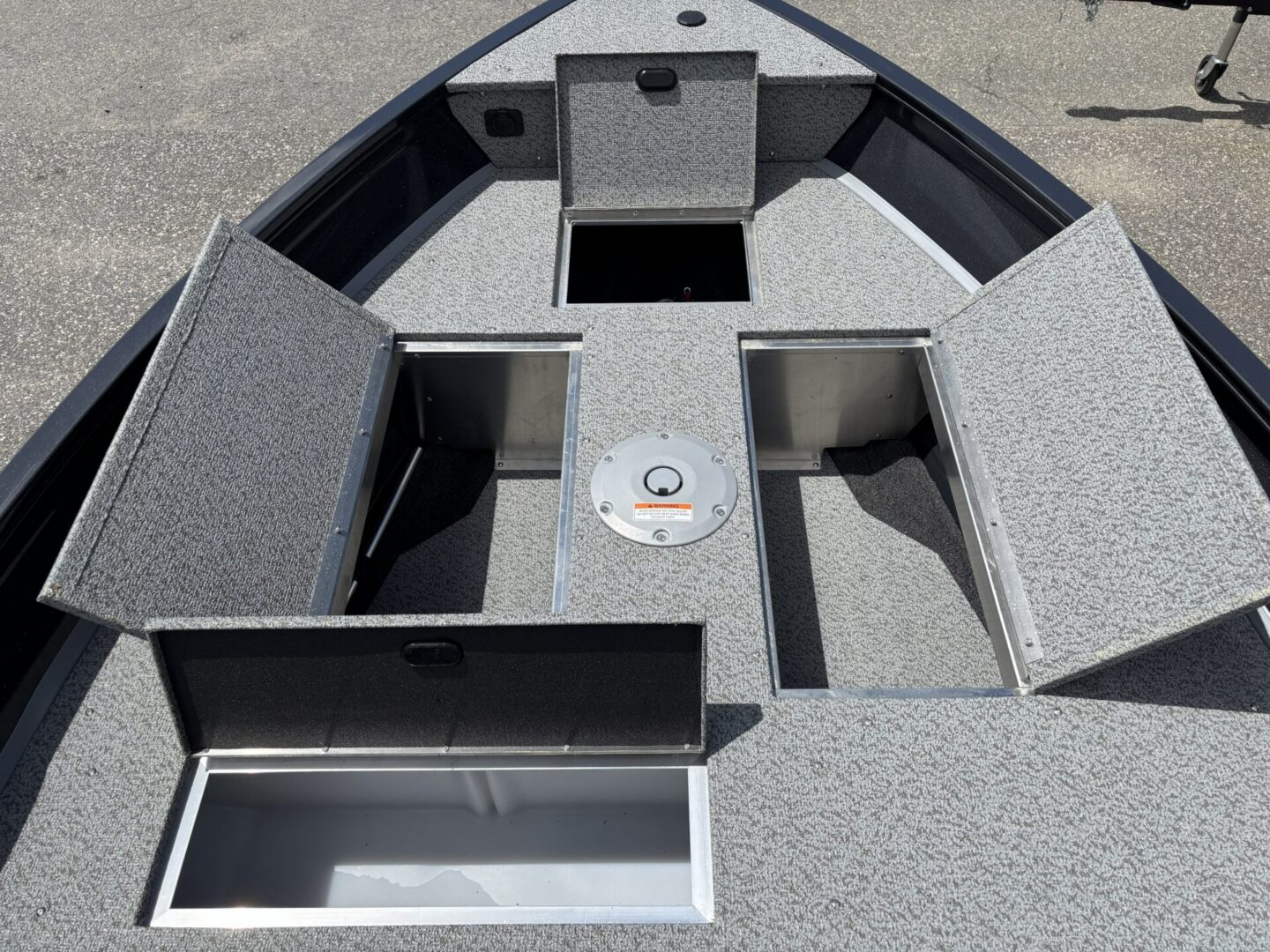 Open bow storage compartments and pedestal plate