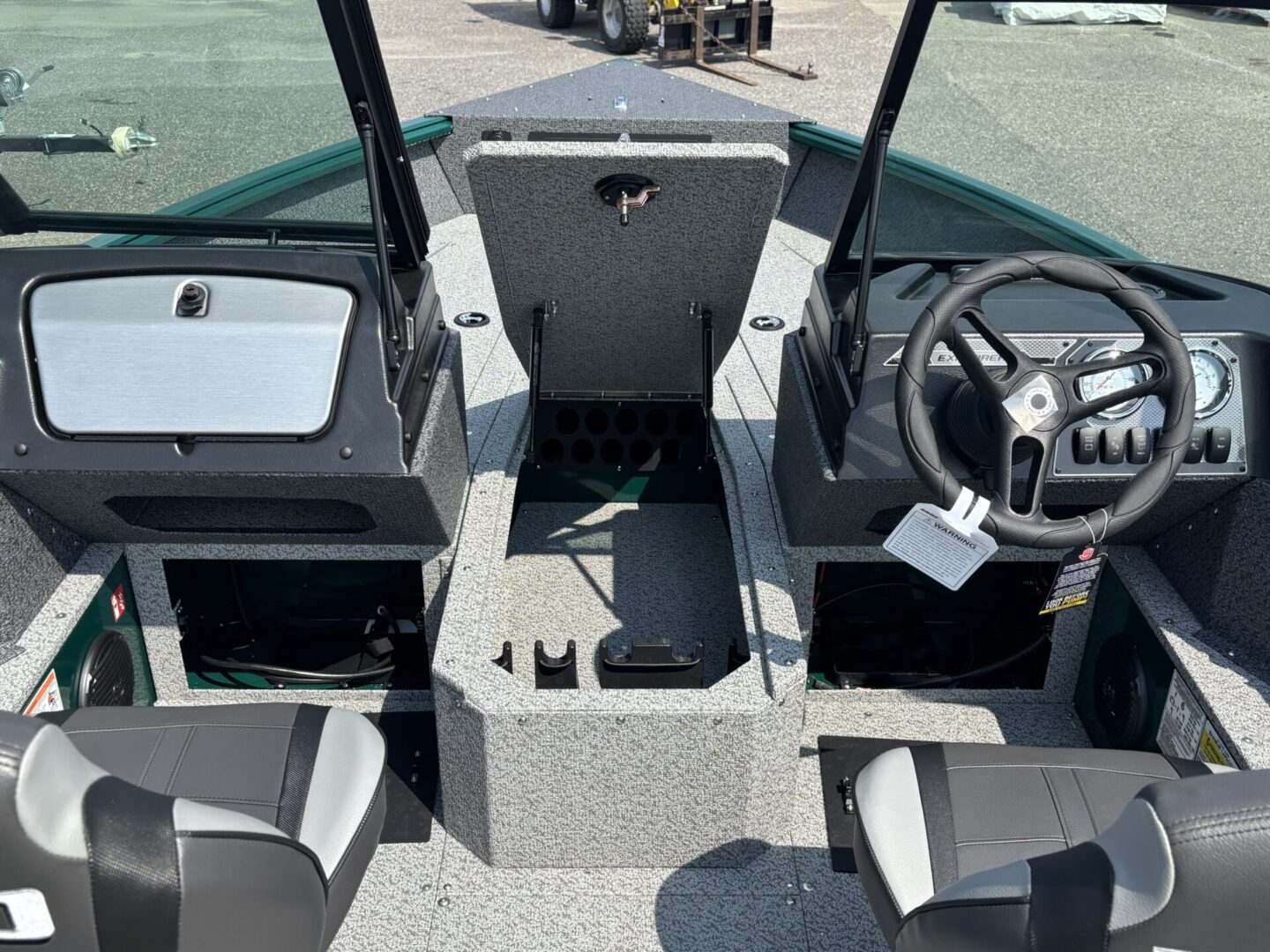 Interior view of a modern fishing boat with storage compartments and seating.