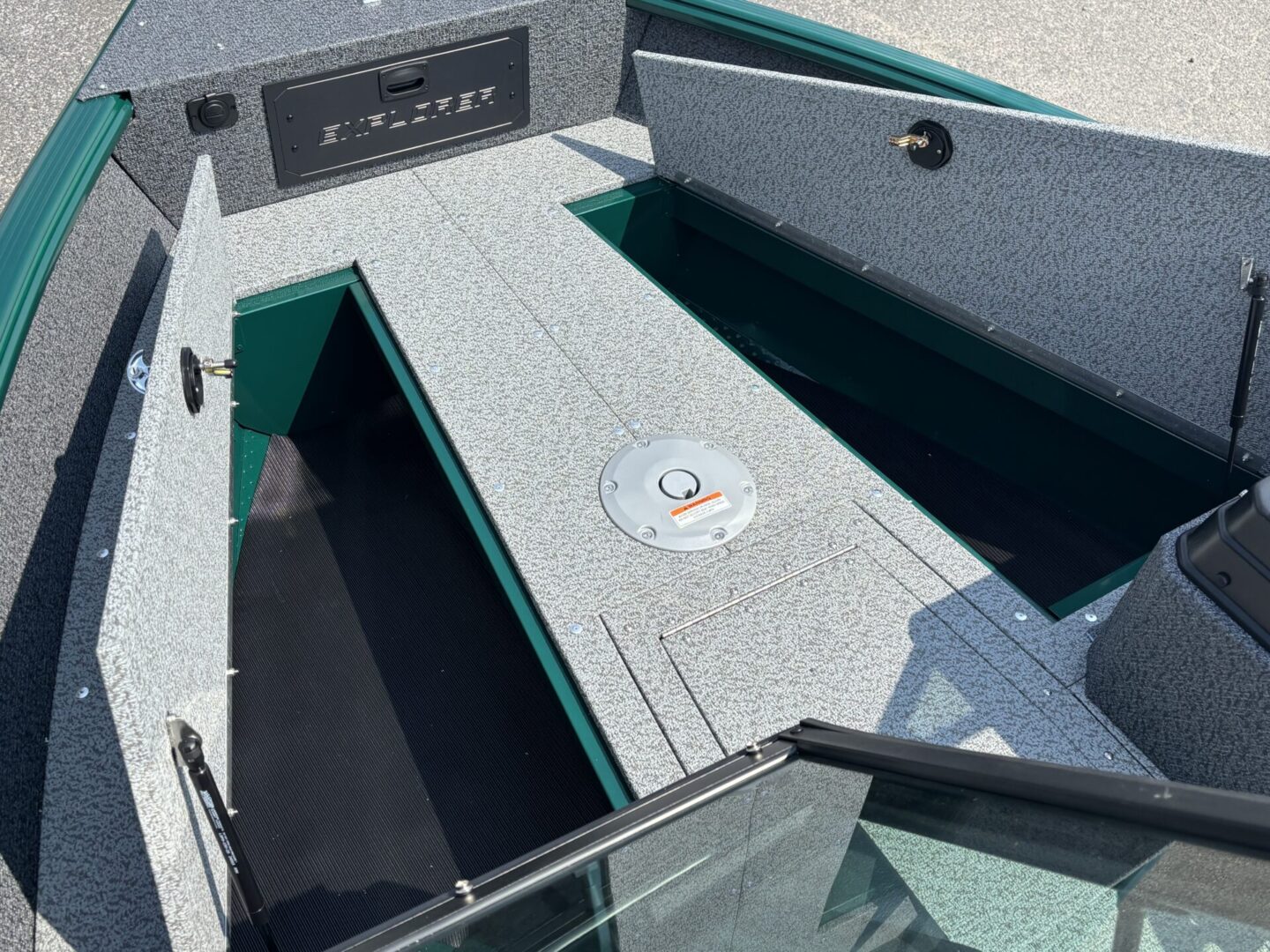 Open compartments of a modern boat showing storage space and clean design.