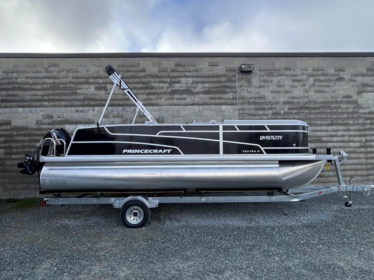 Princecraft pontoon boat side profile on trailer