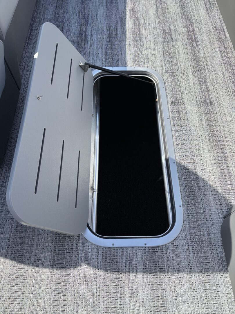 A smartphone inside a white protective case with a flip cover, placed on a textured surface.