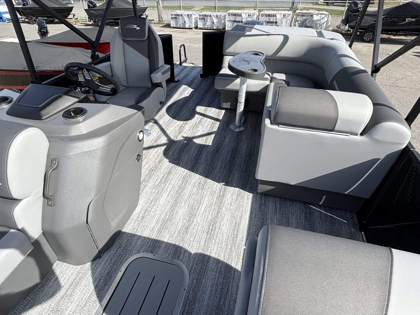Spacious boat deck with modern seating and clean flooring.