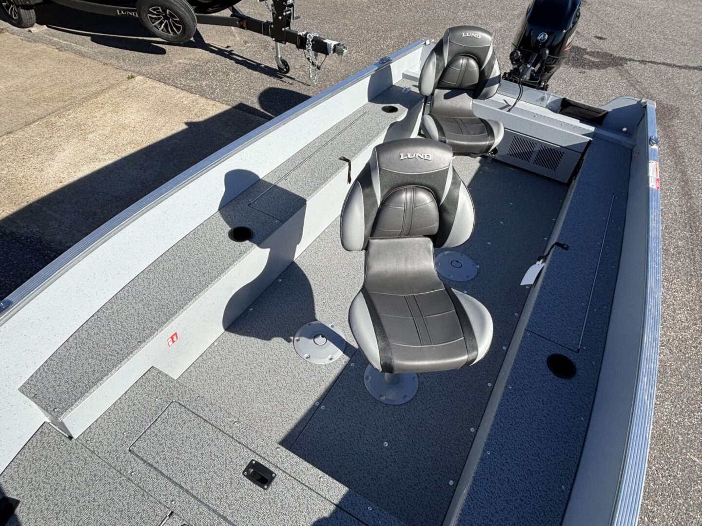 Two comfortable boat seats on a fishing boat deck.