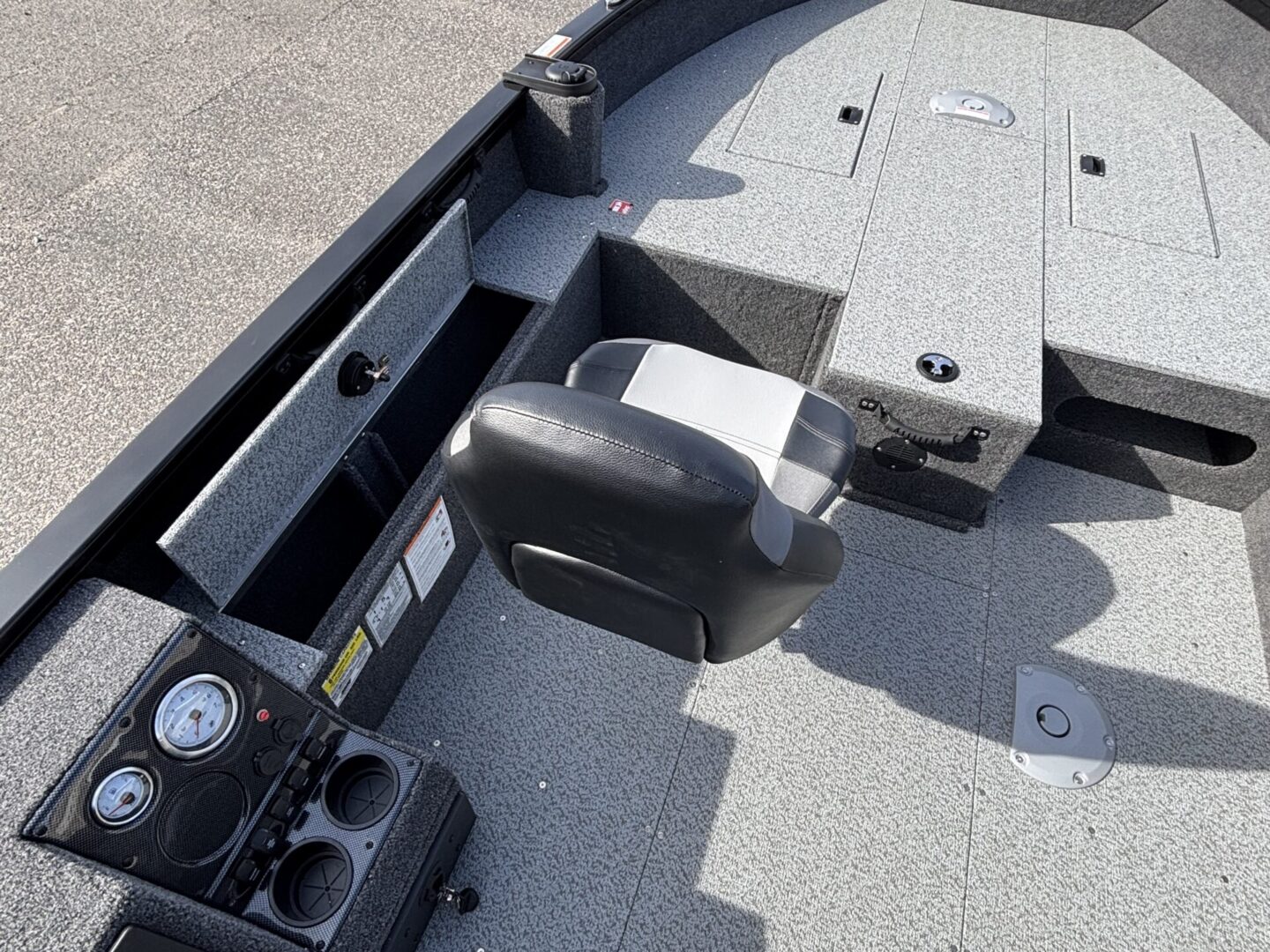 Close-up of a boat's interior showing a seat and part of the deck.