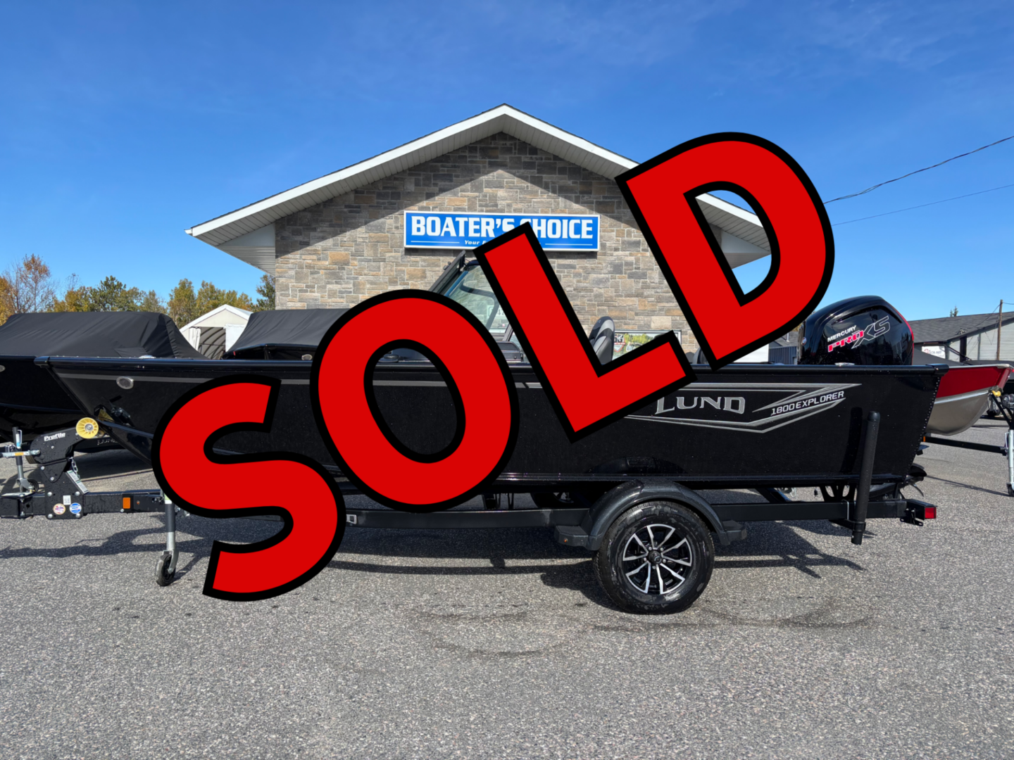 Black Lund boat on trailer marked sold