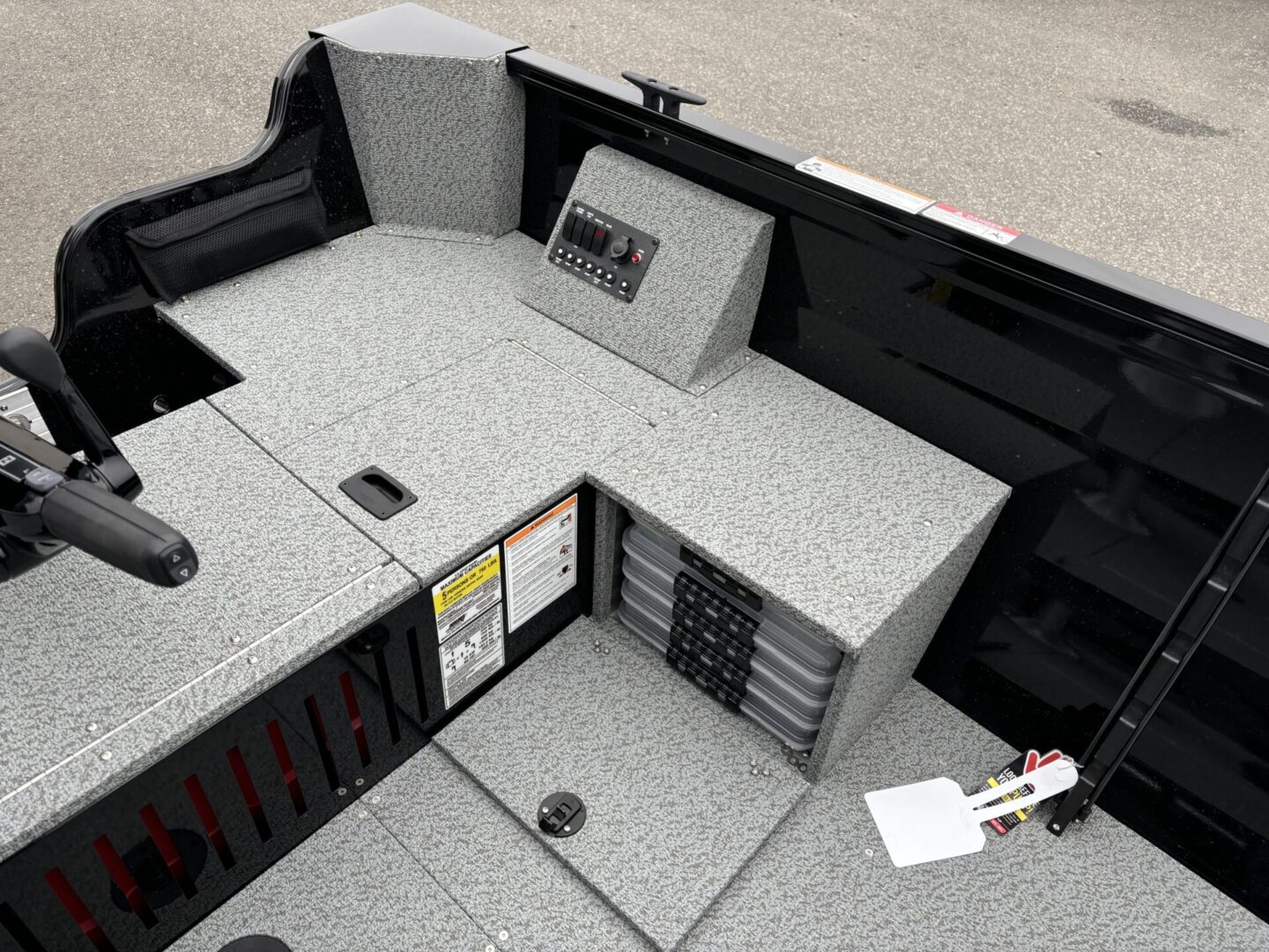 Modern kitchen corner with granite countertops and built-in appliances.