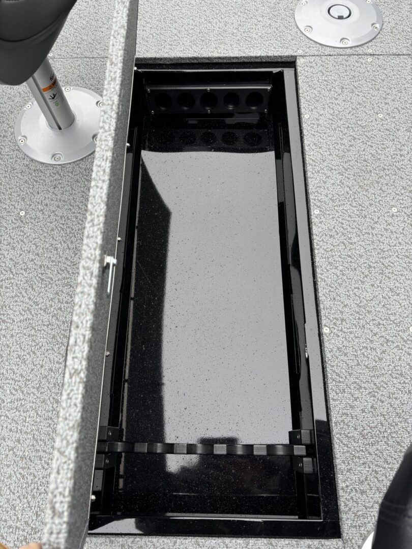A modern rectangular outdoor water feature with clean lines and reflective surface.