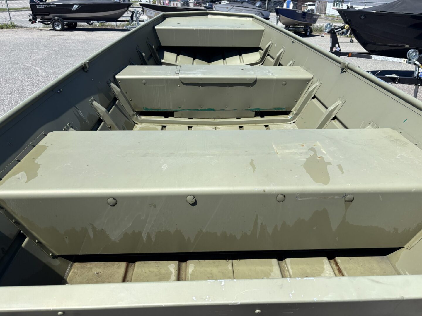 Olive green jon boat interior with benches