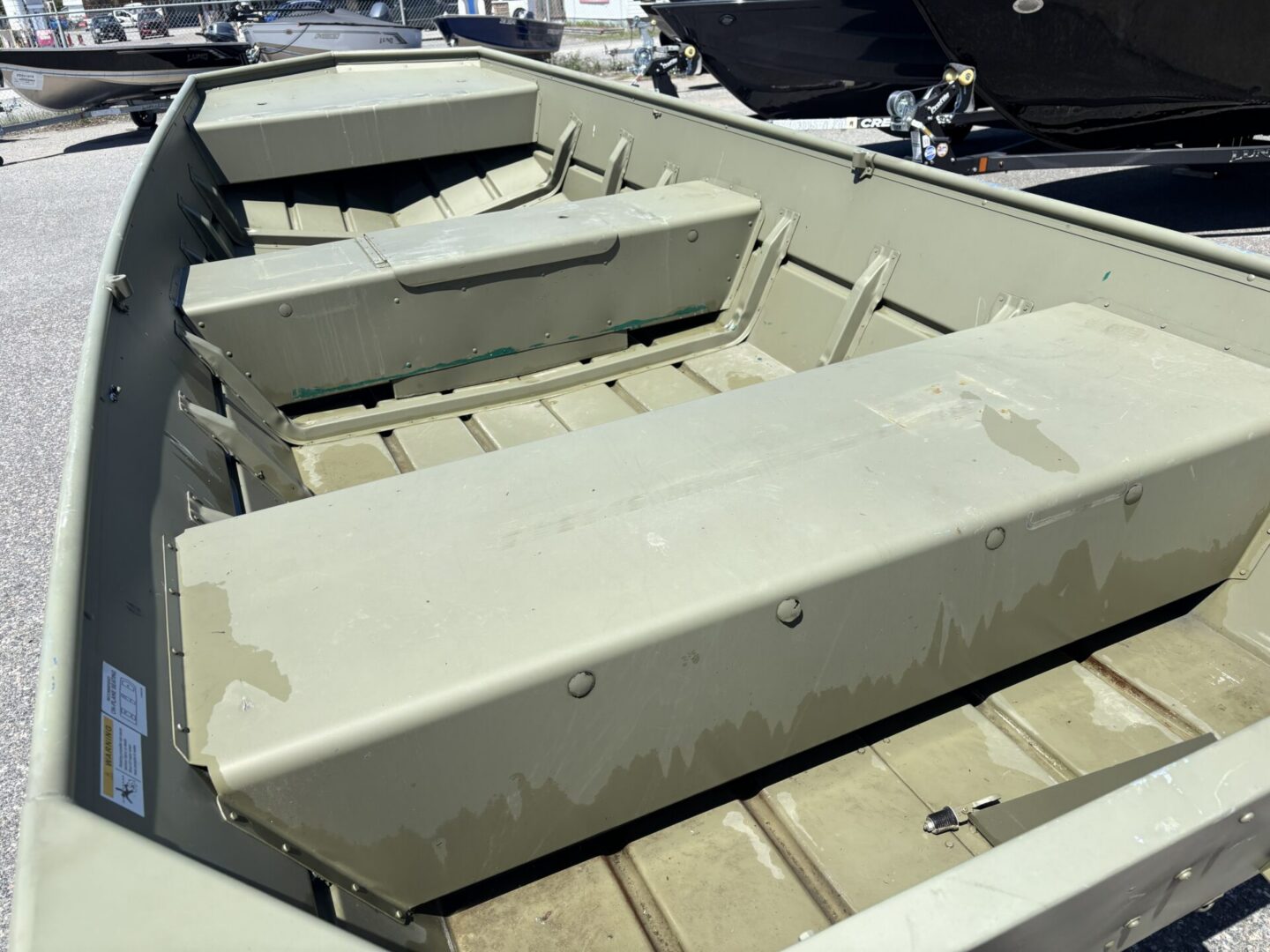 Three bench seats in olive aluminum skiff