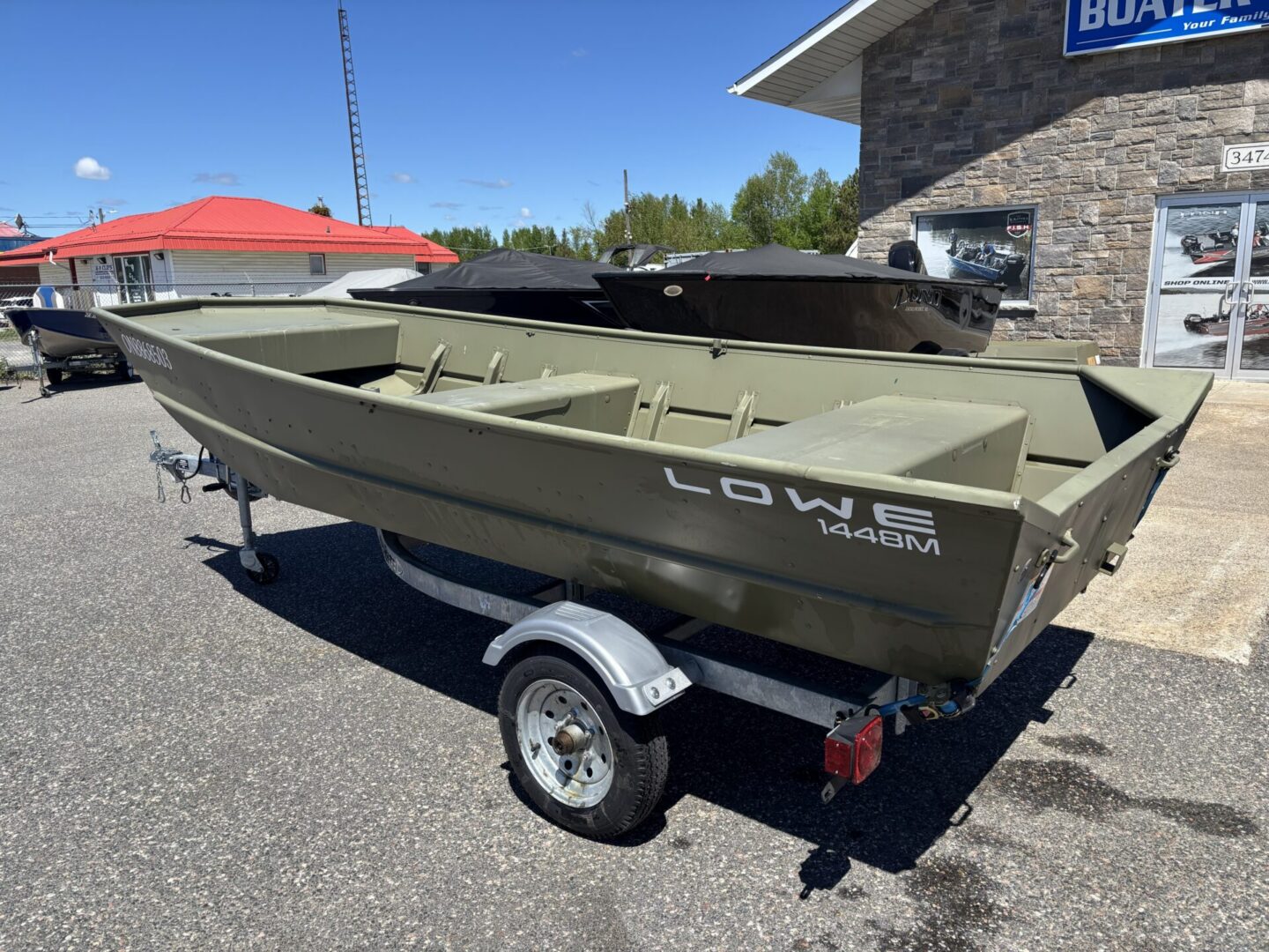Lowe 1448M on single-axle trailer