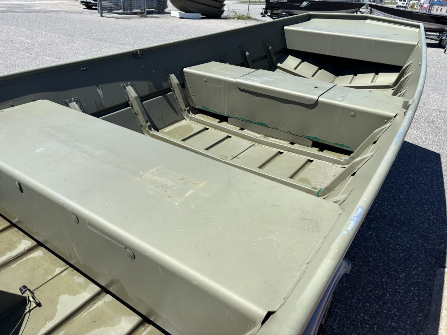 Close-up interior of olive Lowe aluminum boat