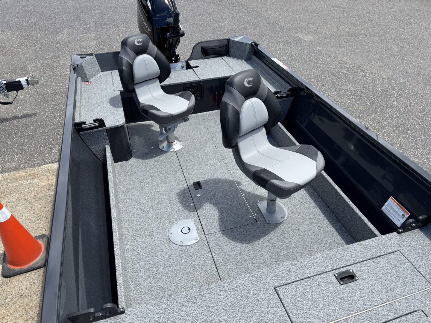 Fishing boat twin seats on gray deck