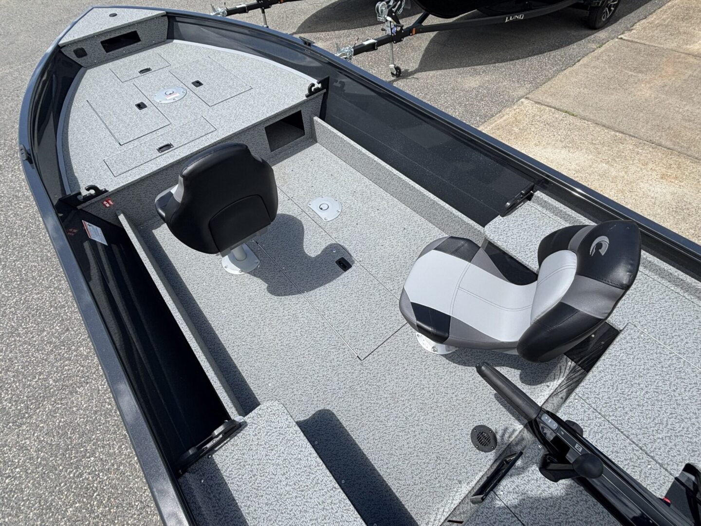 Bow deck and fishing seats with gray carpet
